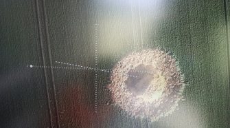 World War II bomb blasts crater in German field