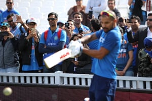 India fans watch Shikhar Dhawan of India warming up during the Group Stage match of the ICC Cricket World Cup 2019 between India and Australia at The Oval.