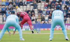 West Indies Evin Lewis is bowled by Chris Woakes of England.