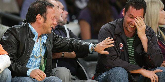 Rob Schneider, left, and Adam Sandler, right, attend Game Five of the Western Conference Semifinals during the 2009 NBA Playoffs at Staples Center on May 12, 2009 in Los Angeles, Calif. (Photo by Noel Vasquez/Getty Images)