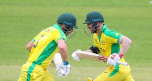 Finch and Warner cross as they run in their strong opening partnership and reach 100 runs.