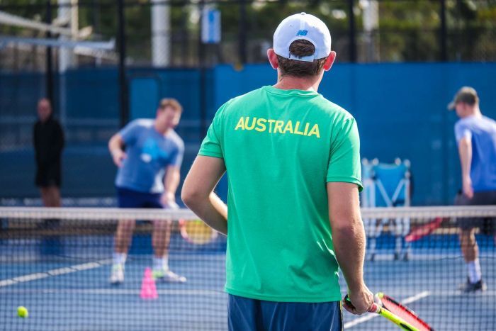 Tennis player with Australian uniform on.