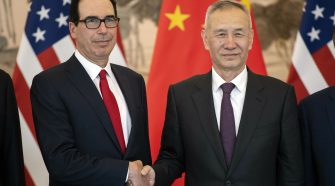 U.S. Treasury Secretary Steven Mnuchin, left, and Chinese Vice Premier and lead trade negotiator Liu He shake hands as they pose for a photo before the opening session of trade negotiations at the Diaoyutai State Guesthouse in Beijing, Thursday, Feb. 14, 2019. (AP Photo/Mark Schiefelbein, Pool)