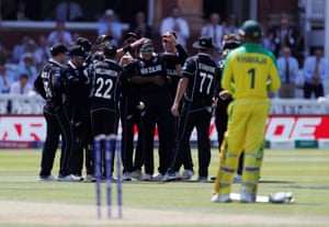 New Zealand players celebrate after Martin Guptill catches out Steve Smith.