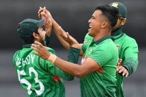 Bangladesh’s Mohammad Saifuddin (R) celebrates taking the wicket of West Indies’ Chris Gayle.