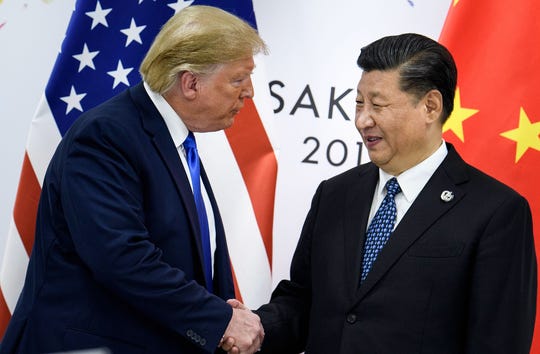 China's President Xi Jinping (right) shakes hands with President Donald Trump before a bilateral meeting on the sidelines of the G-20 summit in Osaka.