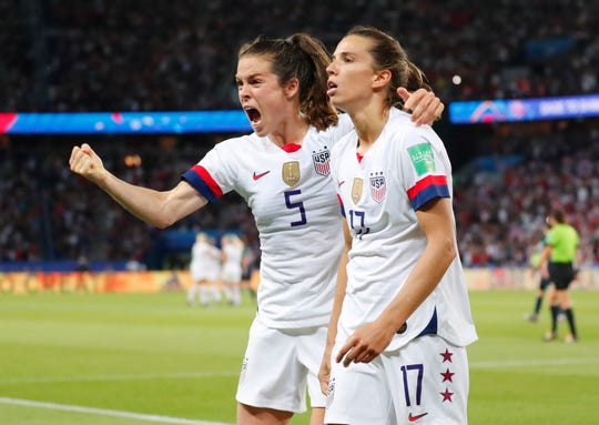 Defender Kelley O'Hara (5) and forward Tobin Heath (17) celebrate after the USA took a 2-0 lead over France in the quarterfinals. The USWNT beat the host nation 2-1.