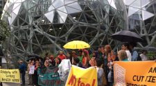 Activists rally outside of the Spheres at Amazon’s Seattle headquarters on Monday. They called on the company to stop selling technology to U.S. Immigration and Customs Enforcement.  (Benjamin Romano / The Seattle Times)