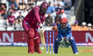 Chris Gayle defends the first ball of the West Indies’ innings .