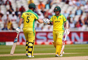 Warner and Finch touch gloves after hitting a four off the first ball.