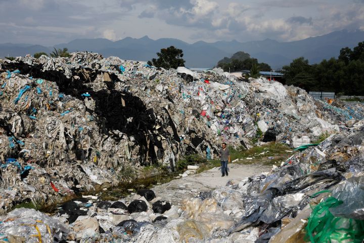 Mountains of plastic waste dumped outside an illegal recycling facility in Malaysia.&nbsp;