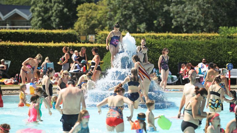 People play in the water at Ilkley outdoor pool and lido in West Yorkshire