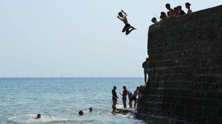 BRIGHTON, ENGLAND - JULY 23: Youths find a way to cool off on Brighton beach on the hottest day of the year on July 23, 2019 in Brighton, England . (Photo by Mike Hewitt/Getty Images)