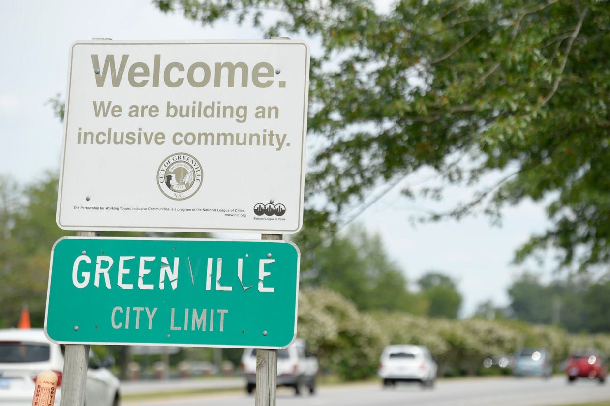 A welcome sign in Greenville, N.C., reads, 