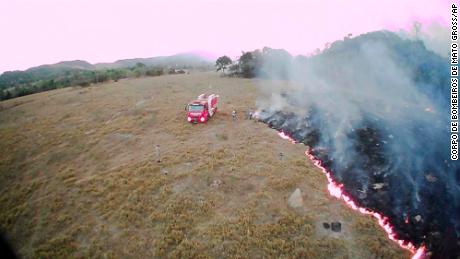 In this August 20, 2019, drone photo released by the Corpo de Bombeiros de Mato Grosso, brush fires burn in Guaranta do Norte municipality, Mato Grosso state, Brazil.