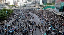 Clashes break out as Hong Kong protesters paralyze city's transport network in strike