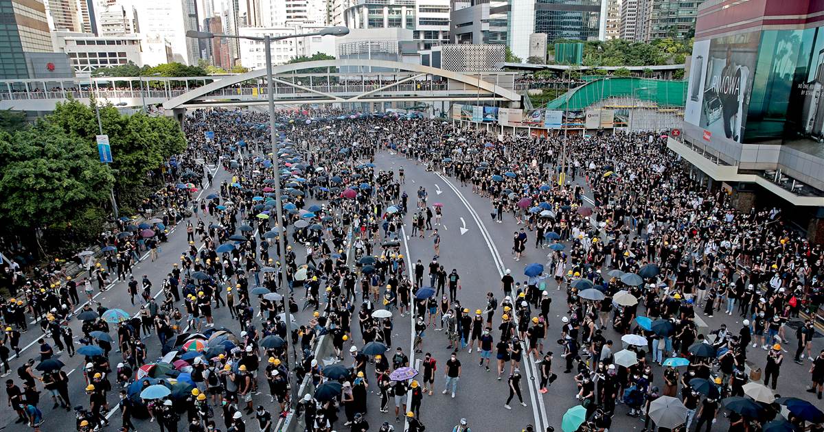 Clashes break out as Hong Kong protesters paralyze city's transport network in strike