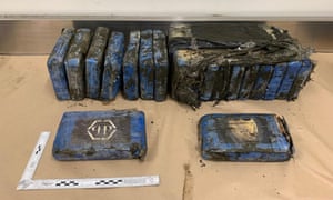 Police officers swept Bethells Beach, west of Auckland, after 19 packages of cocaine washed up on the sand on Wednesday night.