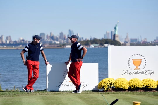 United States team captains Jim Furyk, left, and Steve Stricker wait at hole 10 during the Presidents Cup. The United States defeated the International team 19-11 at the Liberty National Golf Club in Jersey City, NJ on Sunday, October 1, 2017.