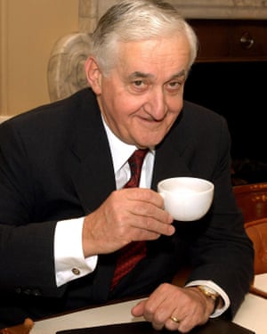 Doug Oakervee, the chair of the inquiry into the HS2 rail network, with a teacup in one hand