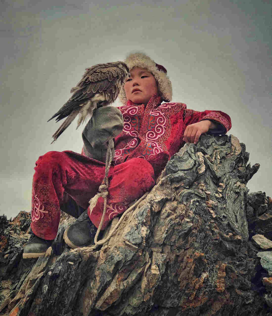 A boy with his hunting eagle in Bayan Ulgi province, Mongolia.