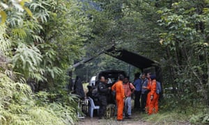Members of search and rescue teams work at a temporary operation shelter near to The Dusun resort where Nora Quoirin went missing on Sunday.
