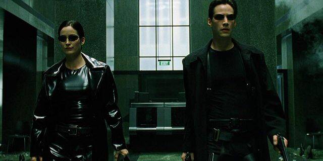 Carrie-Anne Moss as Trinity and Keanu Reeves as Neo. 