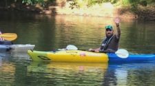 Man kayaking down the Ohio River for mental health awareness