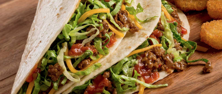 The "softshell tacos" from Taco John's are shown in a photo from the chain's website.