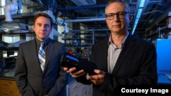 A prototype of a marijuana breathalyzer device developed researchers from the University of Pittsburgh is shown. The device is presented by Ervin Sejdic, (left) PhD, an associate professor of electrical and computer engineering at the Swanson School.