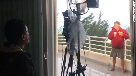 Jose Armijo shoots Patrick Oppmann&#39;s reporting from the balcony of an ocean-view apartment as Hurricane Dorian pounds Freeport.