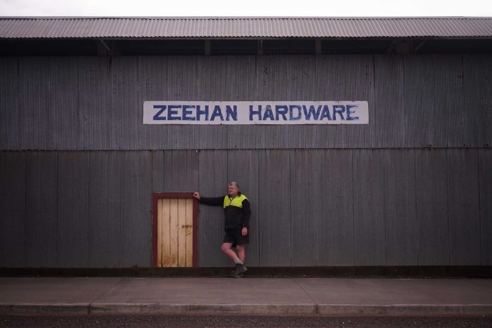 Zeehan hardware store owner, Don Edmonston, stands outside his business.