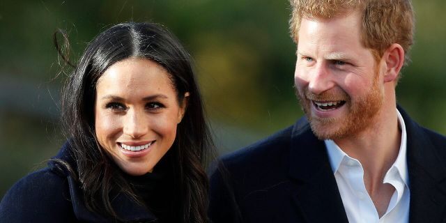 In this Dec. 1, 2017 file photo, Britain's Prince Harry and his fiancee Meghan Markle arrive at Nottingham Academy in Nottingham, England.