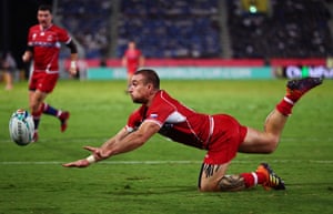 Vladimir Ostroushko of Russia dives to catch the ball but is unable to touch it down.