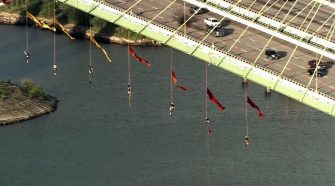 Greenpeace activists suspend themselves from Houston's Fred Hartman Bridge to protest fossil fuel