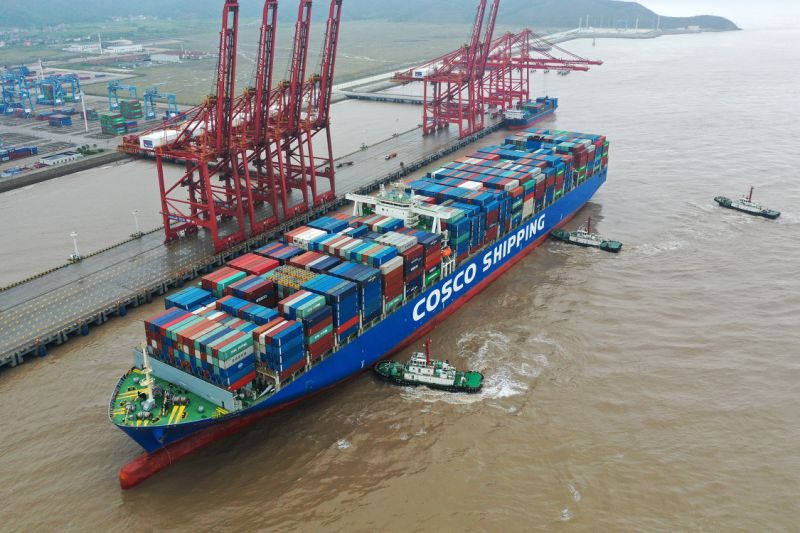 ZHOUSHAN, CHINA - SEPTEMBER 01: Aerial view of a Cosco France container ship berthing with the help of tugboats at the Port of Ningbo-Zhoushan on September 1, 2019 in Zhoushan, Zhejiang Province of China. The Cosco France container ship, coming from Singapore, will unload 8,015 twenty-foot equivalent unit (TEU) containers at the Port of Ningbo-Zhoushan. (Photo by Yao Feng/VCG via Getty Images)