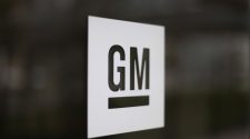 FILE - This May 16, 2014, file photo shows the General Motors logo at the company's world headquarters in Detroit. The United Auto Workers union is le