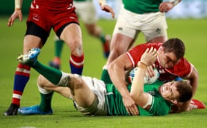 Garry Ringrose of Ireland, tackled by Kirill Gotovtsev of Russia.