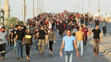 Iraq's PM calls for talks as thousands of protesters defy curfew | News