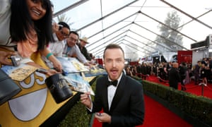 Meet and greet: signing autographs as he arrives at the 20th annual Screen Actors Guild Awards in Los Angeles.