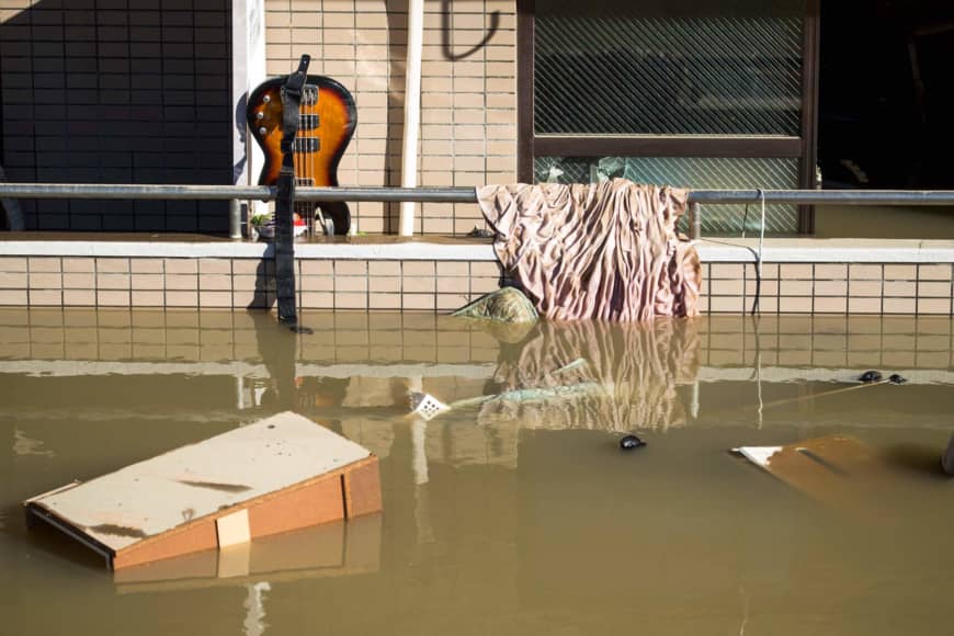 Floating debris is seen in a residential block as floodwaters recede in the aftermath of Typhoon Hagibis in Kawasaki. | AFP-JIJI