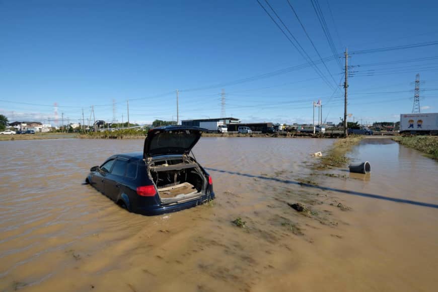 A car sits in a flooded field in Higashimatsuyama, Saitama Prefecture, after Typhoon Hagibis swept through central and eastern Japan. | AFP-JIJI