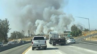 Crews battle fast-moving brush fire just outside L.A. hours after blaze tears through mobile home park
