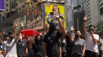 Hong Kong introduces emergency powers to ban face masks at protests