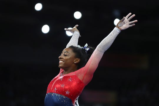 Simone Biles of the United States performs on the vault during the women's team final at the Gymnastics World Championships in Stuttgart, Germany, on Oct. 8, 2019. (AP Photo/Matthias Schrader)