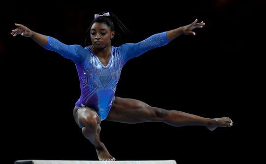 Simone Biles performs on the beam during the apparatus finals at the Gymnastics World Championships at the Hanns-Martin-Schleyer-Halle in Stuttgart, Germany.