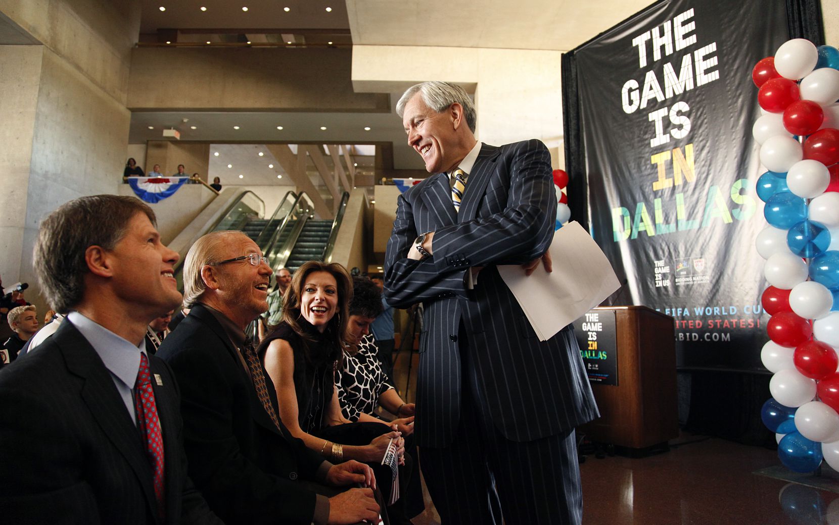 Dallas mayor Tom Leppert (standing) shares a laugh with Jim Graham, (second from left) and Clark Hunt in 2010.