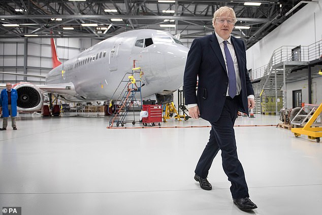 Painting a grim picture of an SNP-backed Labour government, Mr Johnson (pictured in a hangar on a visit to the International Aviation Academy, Norwich, yesterday) pointed to Mr Corbyn's neutrality on Brexit and historic sympathies with the IRA as evidence