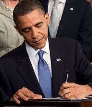 Obama signing the Patient Protection and Affordable Care Act at the White House/Wikimedia Commons