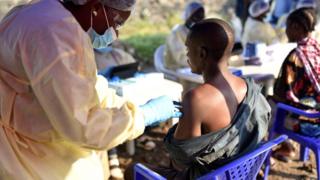 Man being given the Ebola vaccine in DR Congo